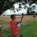 Sisse checks the wind speed during a sniff survey